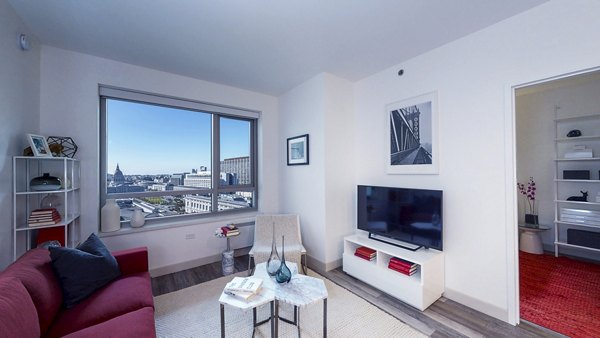 Spacious living room with modern decor at 1177 Market Apartments, luxury property by Greystar in San Francisco