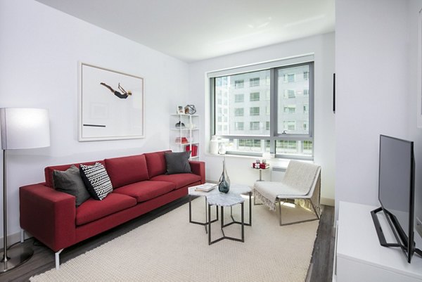 Inviting living room with modern decor and natural light at 1177 Market Apartments