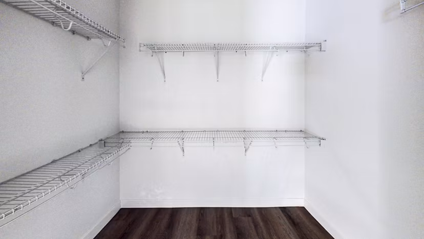 Bedroom closet with ample storage space in 1188 Mission Apartments