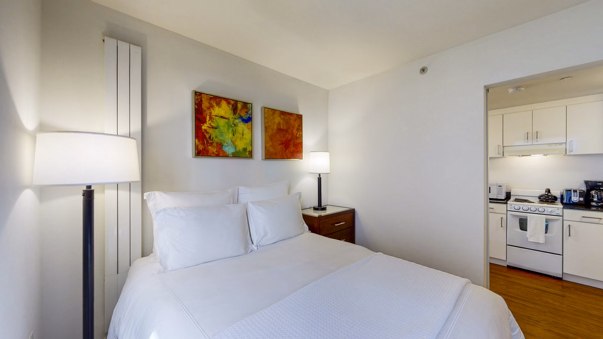 Comfortable bedroom with city views at 1188 Mission Apartments in San Francisco
