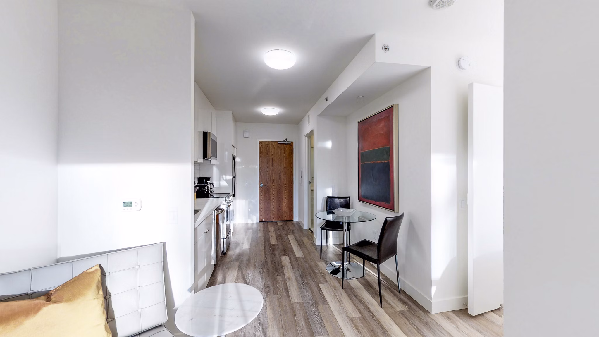 Dining room with contemporary design and elegant dining set at 1188 Mission Apartments