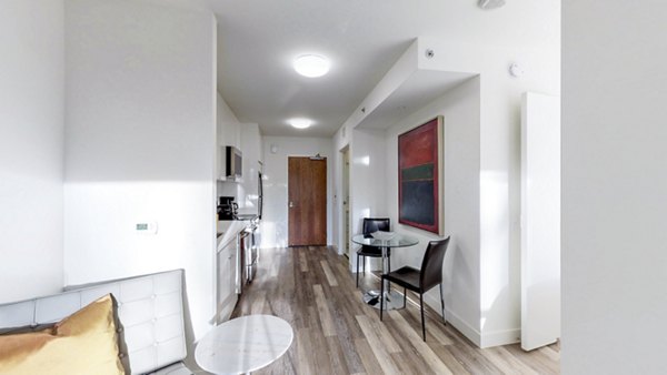 Dining room with contemporary design and elegant dining set at 1188 Mission Apartments
