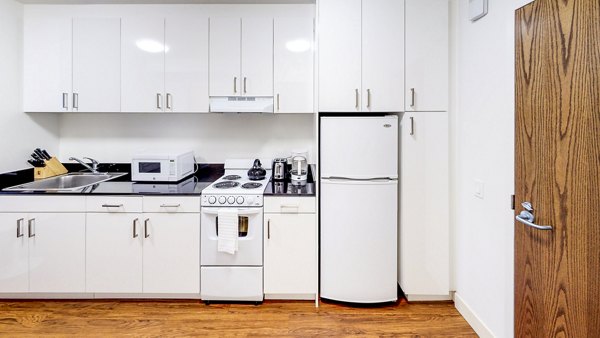 Sleek modern kitchen featuring stainless steel appliances at 1188 Mission Apartments in San Francisco