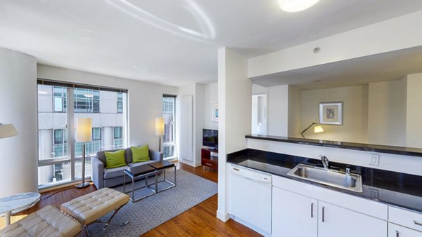 Sleek kitchen with stainless steel appliances in 1188 Mission Apartments