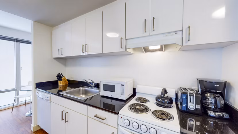 Modern kitchen with sleek countertops and stainless steel appliances at 1188 Mission Apartments