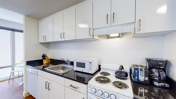 Modern kitchen with sleek countertops and stainless steel appliances at 1188 Mission Apartments