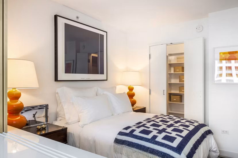 Serene bedroom with modern decor at 1190 Mission Apartments, offering luxury living in the heart of the city