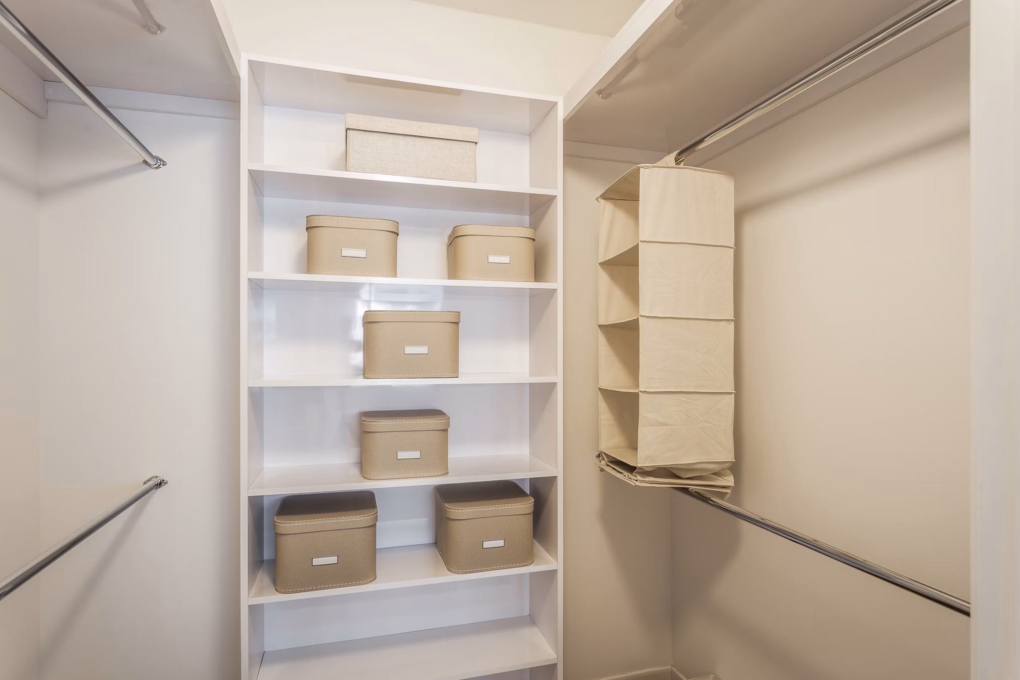 Walk-in bedroom closet with shelving at 1190 Mission Apartments