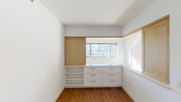 Cozy bedroom with modern design elements at 1190 Mission Apartments, luxury living in a Greystar community