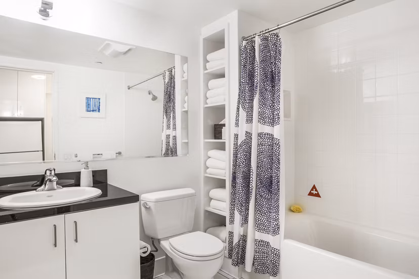 Bathroom featuring modern fixtures and large vanity in 1190 Mission Apartments