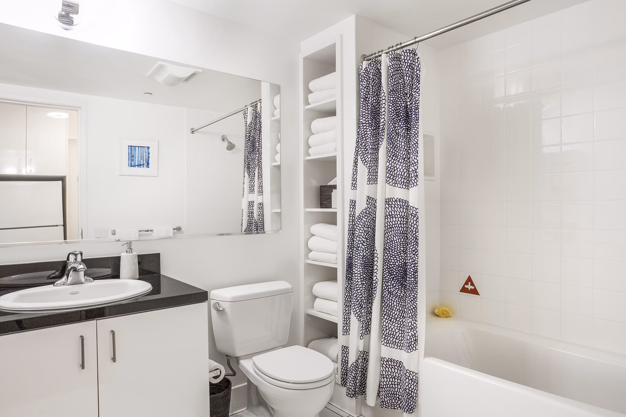 Bathroom featuring modern fixtures and large vanity in 1190 Mission Apartments