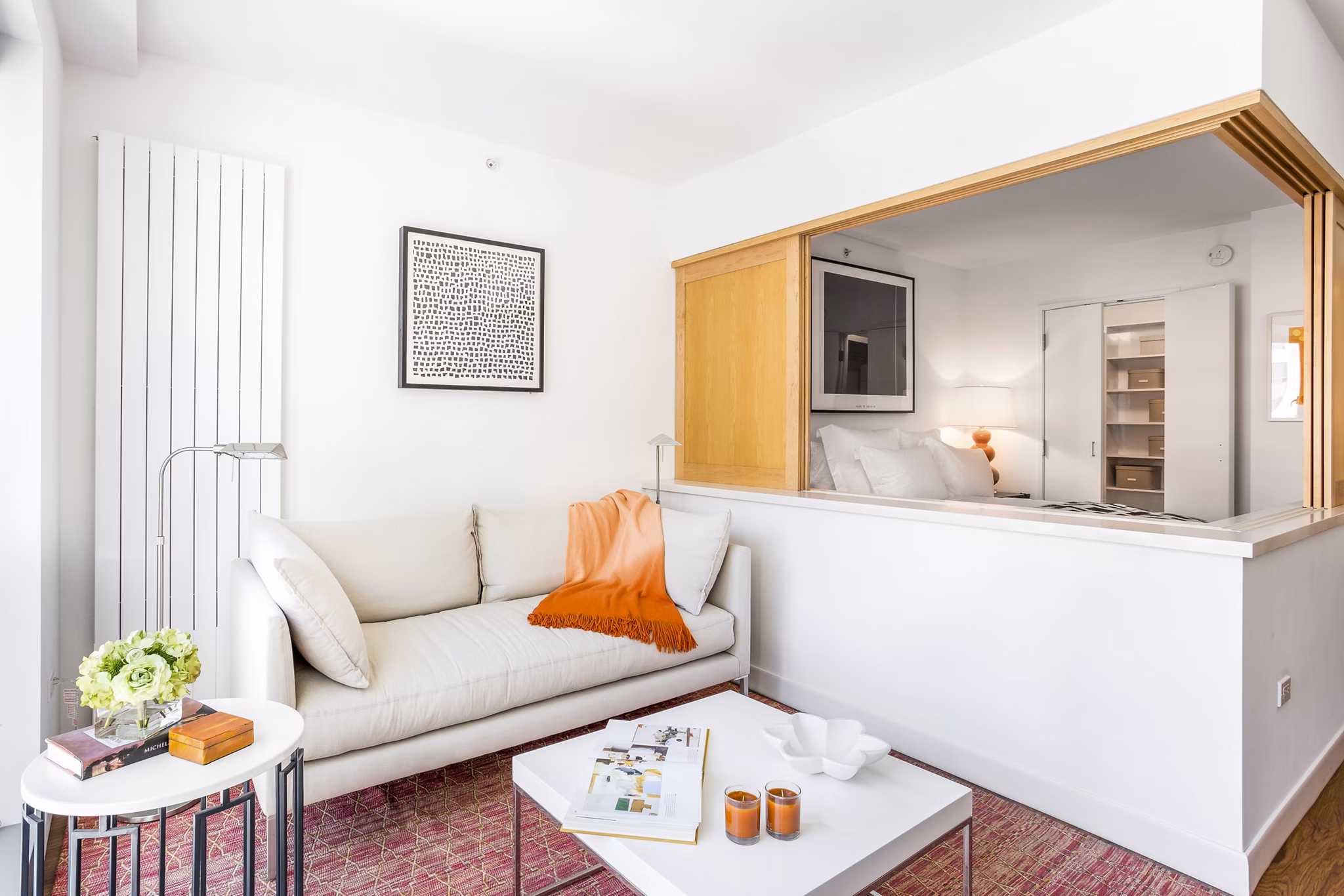 Modern living room with sleek furniture and large windows at 1190 Mission Apartments in San Francisco