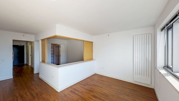 Spacious living room with modern decor in 1190 Mission Apartments