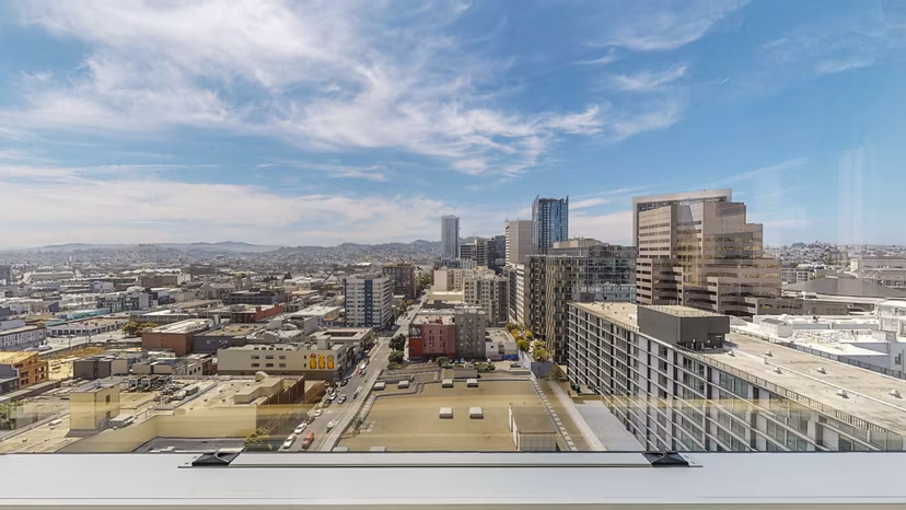 1190 Mission Apartments: Panoramic city view from a luxury high-rise balcony