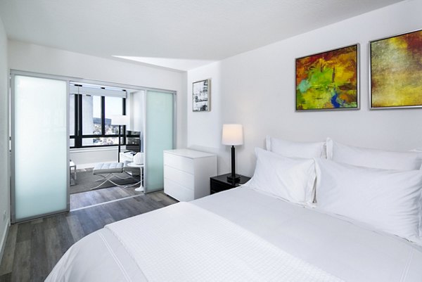 Cozy bedroom featuring modern design elements at 2000 Broadway Apartments
