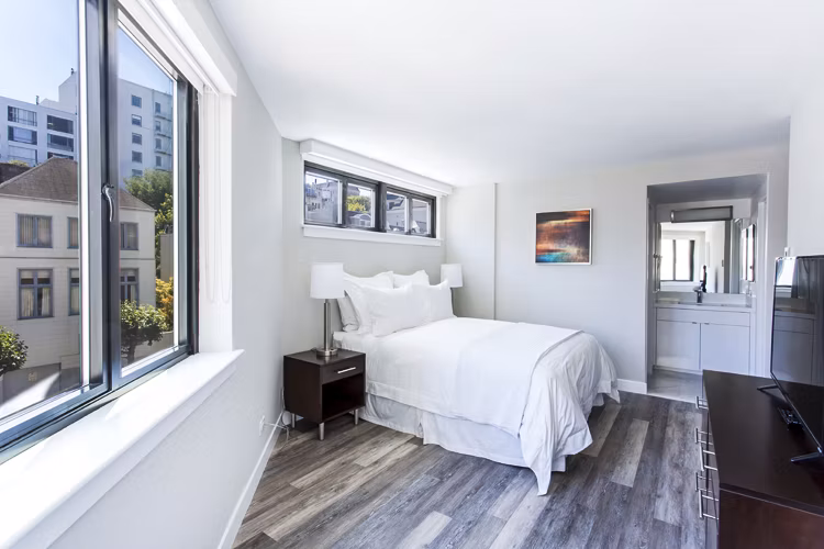 Cozy bedroom with modern decor at 2000 Broadway Apartments: Luxury living in the heart of the city
