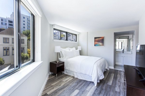Cozy bedroom with modern decor at 2000 Broadway Apartments: Luxury living in the heart of the city
