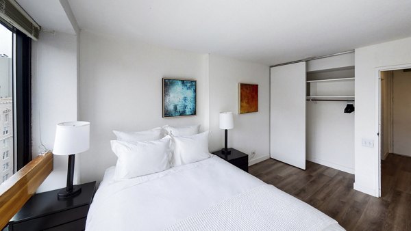 Cozy bedroom with modern furnishings in 2000 Broadway Apartments