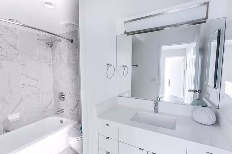 Bathroom featuring sleek fixtures and modern design at 2000 Broadway Apartments, luxury living by Greystar