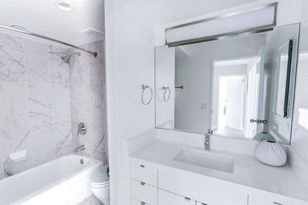Bathroom featuring sleek fixtures and modern design at 2000 Broadway Apartments, luxury living by Greystar