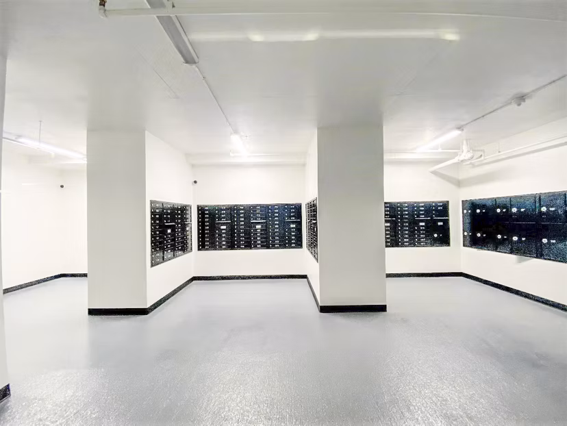 Mailroom with secure package lockers at 2000 Broadway Apartments