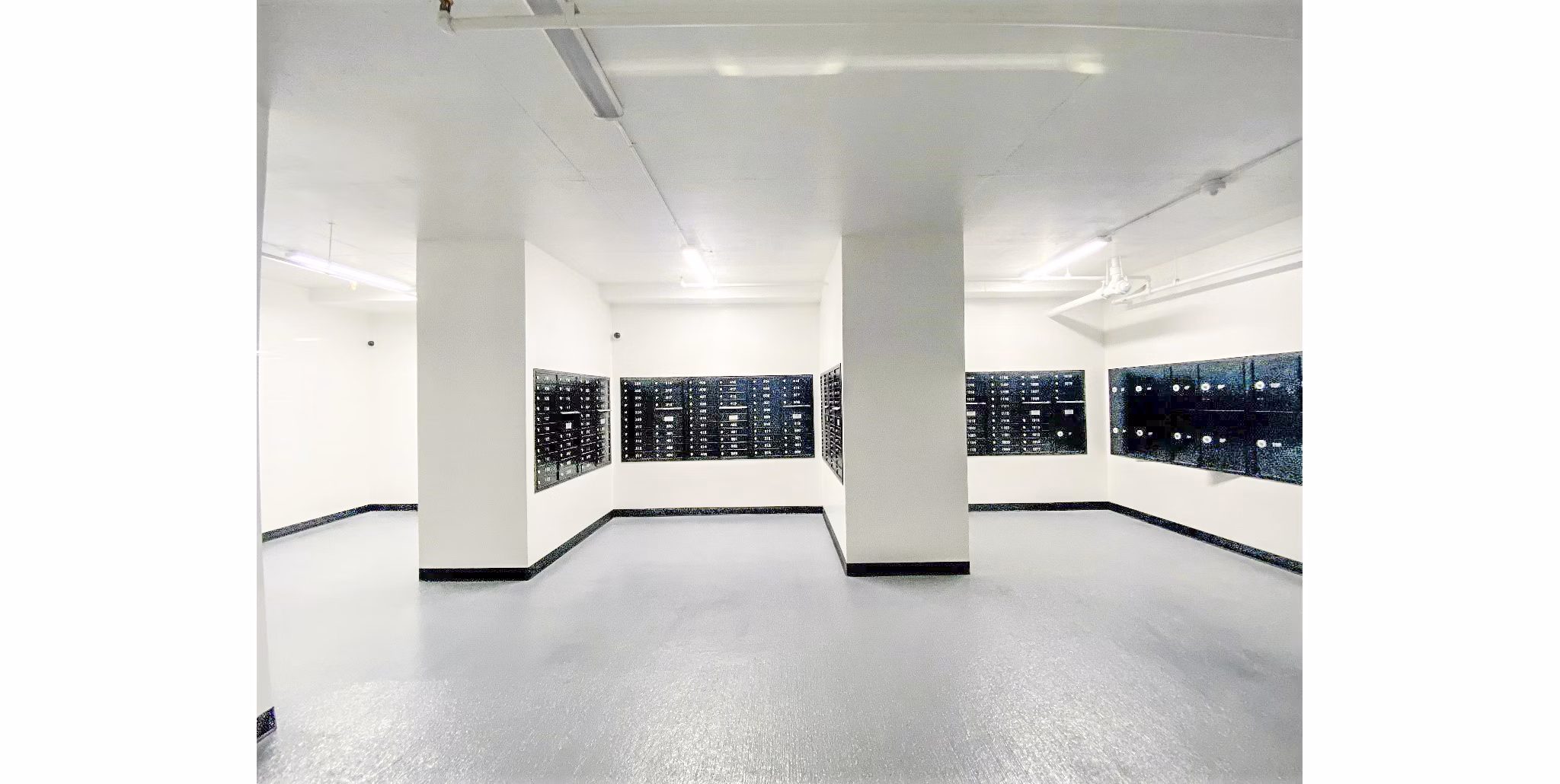Mailroom with secure package lockers at 2000 Broadway Apartments