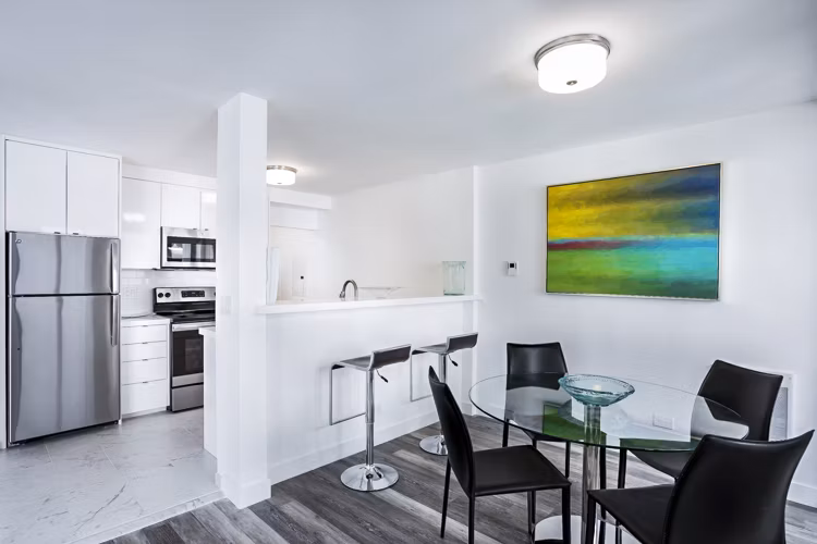 Dining room with modern furnishings and natural light at 2000 Broadway Apartments, showcasing luxury living in Greystar's iconic urban setting