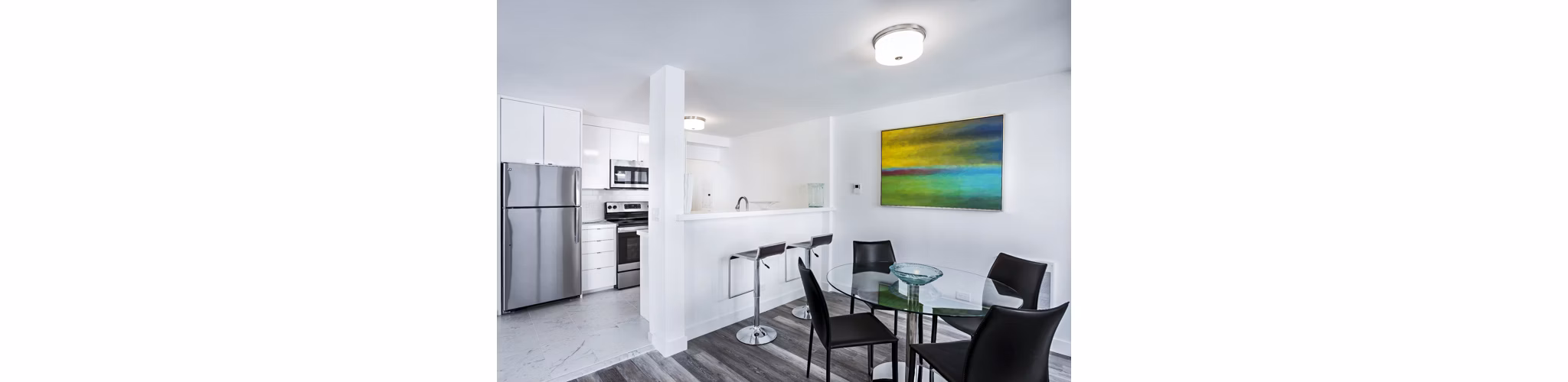 Dining room with modern furnishings and natural light at 2000 Broadway Apartments, showcasing luxury living in Greystar's iconic urban setting