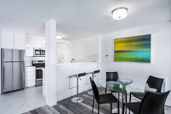 Dining room with modern furnishings and natural light at 2000 Broadway Apartments, showcasing luxury living in Greystar's iconic urban setting