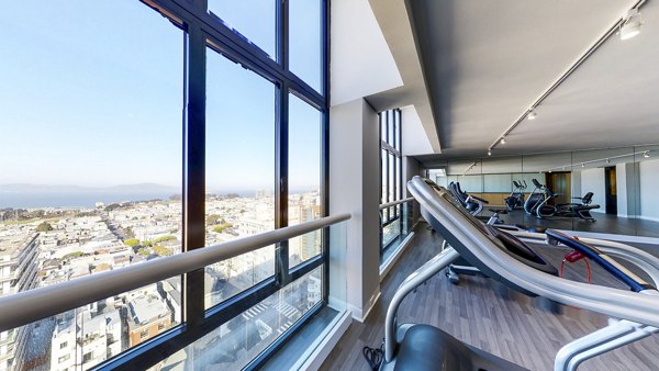 Fully-equipped fitness center at 2000 Broadway Apartments with cardio machines and weights for residentsâ€™ active lifestyle