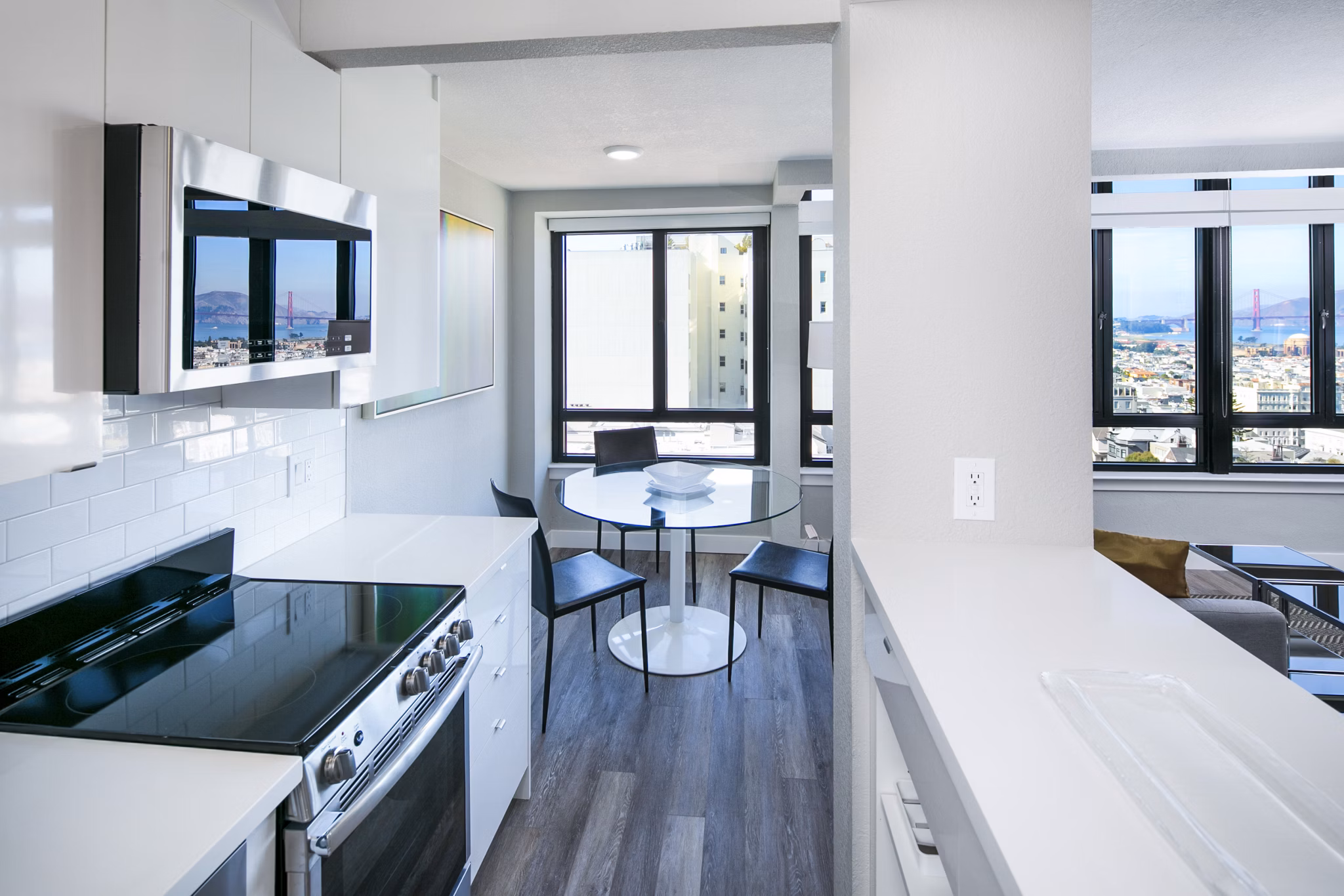Modern kitchen featuring stainless steel appliances and granite countertops at 2000 Broadway Apartments, luxury living spaces in the heart of the city