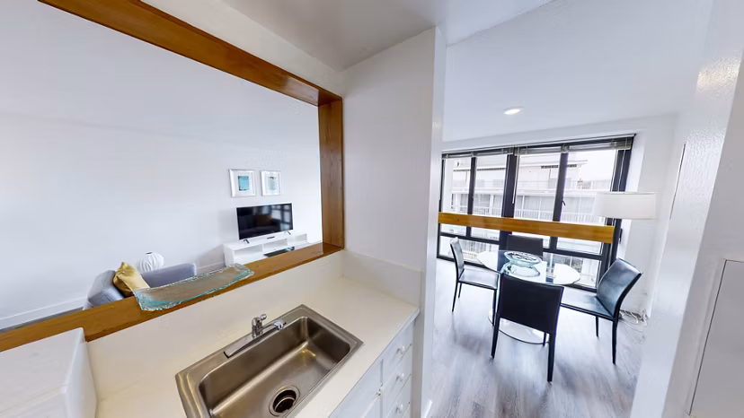 Modern kitchen with stainless steel appliances in 2000 Broadway Apartments