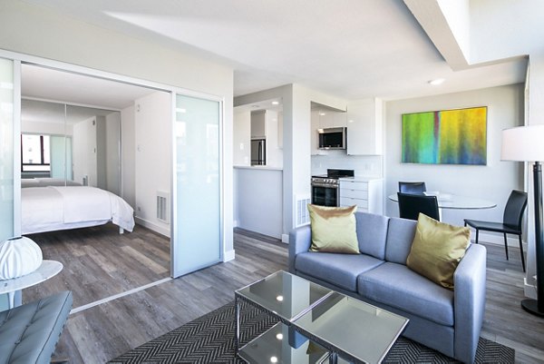 Spacious living room with modern furnishings at 2000 Broadway Apartments