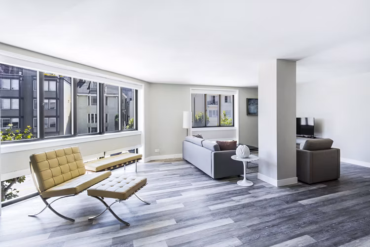 Open-concept living room with stylish decor at 2000 Broadway Apartments, highlighting modern luxury living in a central location