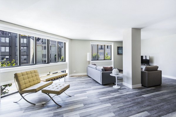Open-concept living room with stylish decor at 2000 Broadway Apartments, highlighting modern luxury living in a central location