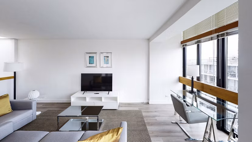 Spacious living room with contemporary furnishings at 2000 Broadway Apartments