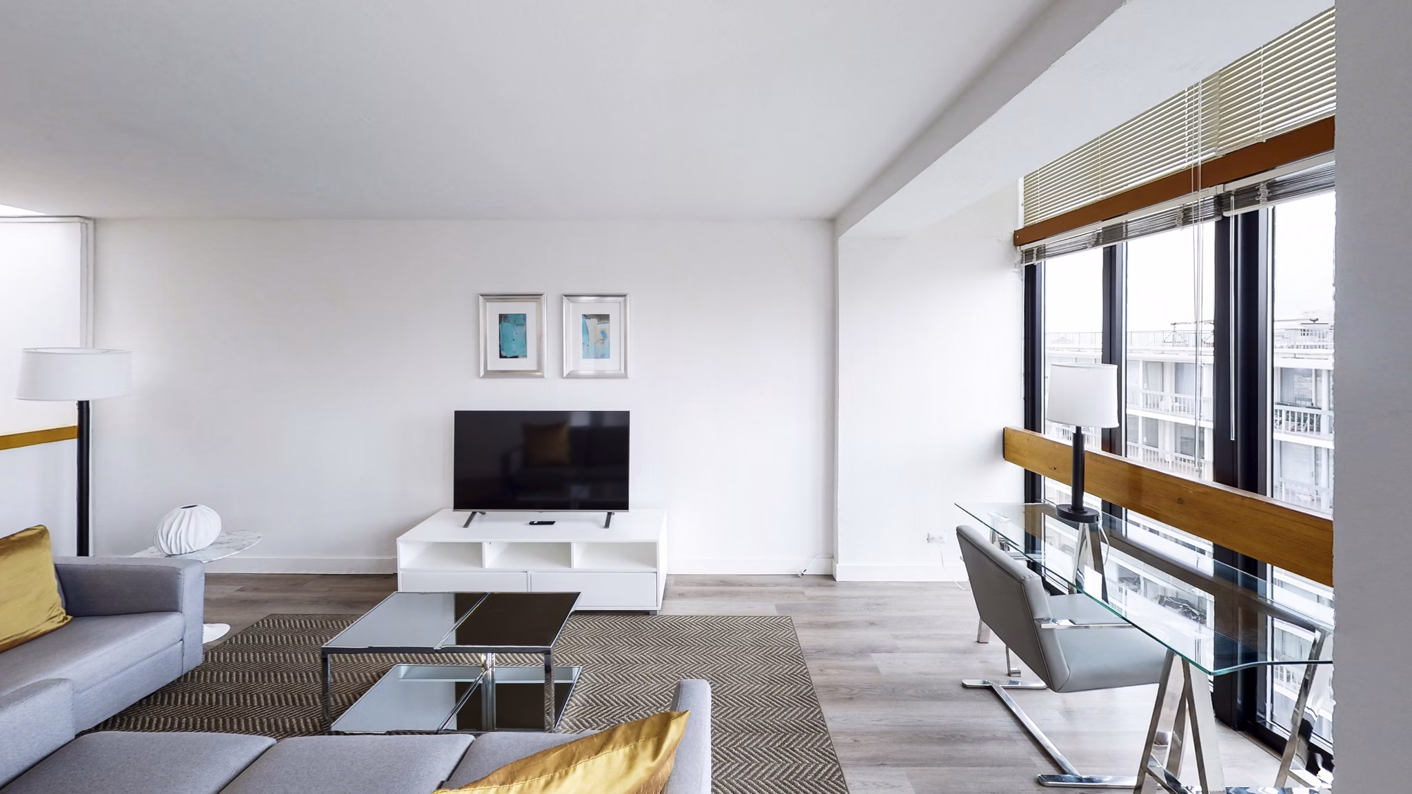 Spacious living room with contemporary furnishings at 2000 Broadway Apartments