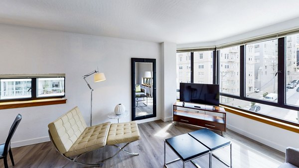 Bright living room with modern decor at 2000 Broadway Apartments
