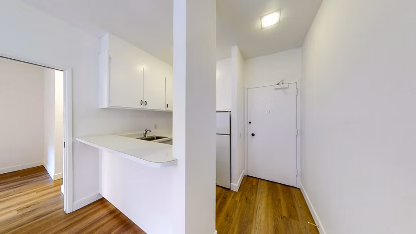 Modern kitchen with stainless steel appliances at 2133 Stockton Apartments, Greystar luxury apartments in San Francisco