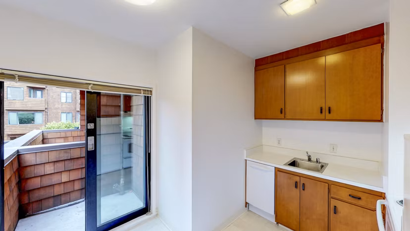 Modern kitchen with stainless steel appliances at 2133 Stockton Apartments