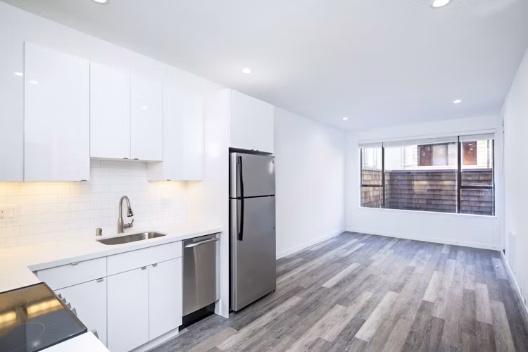 Modern kitchen with sleek finishes at 2133 Stockton Apartments: luxury living in a prime location