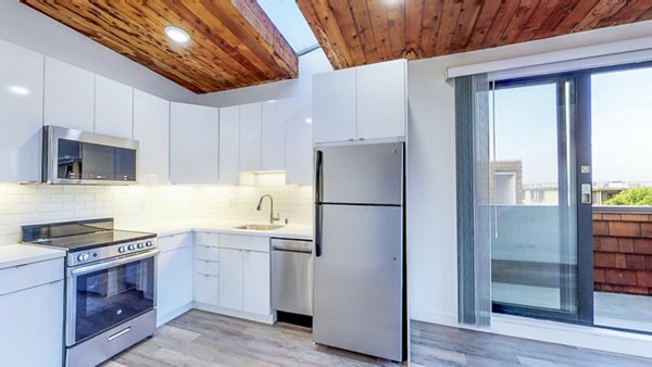 Modern kitchen with sleek finishes at 2133 Stockton Apartments, luxury living in a Greystar community