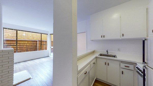 Modern kitchen with stainless steel appliances at 2133 Stockton Apartments