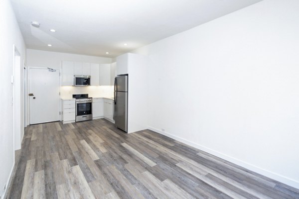 Cozy living room with stylish furnishings at 2133 Stockton Apartments, offering luxury living in a vibrant community