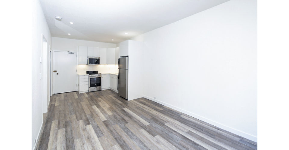 Cozy living room with stylish furnishings at 2133 Stockton Apartments, offering luxury living in a vibrant community
