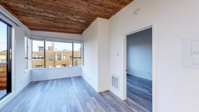 Spacious living room with modern dÃ©cor and natural light at 2133 Stockton Apartments