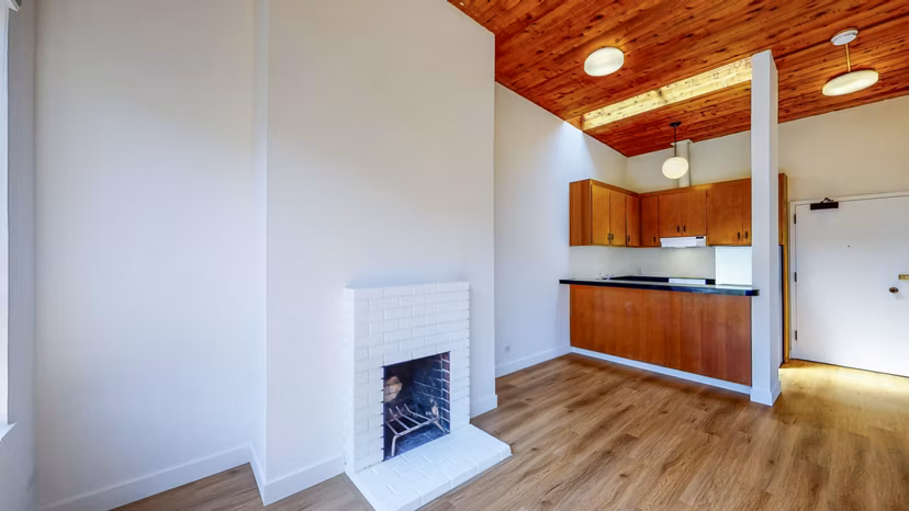 Spacious living room with modern furnishings in 2133 Stockton Apartments