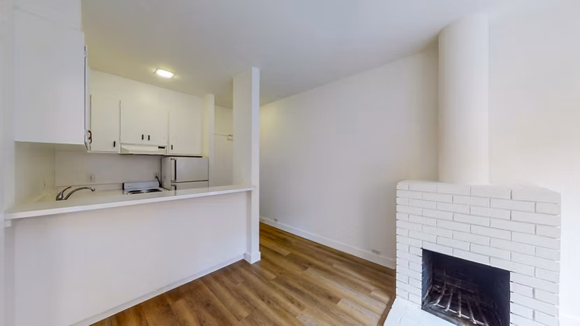 Living room with modern furnishings and large windows at 2133 Stockton Apartments