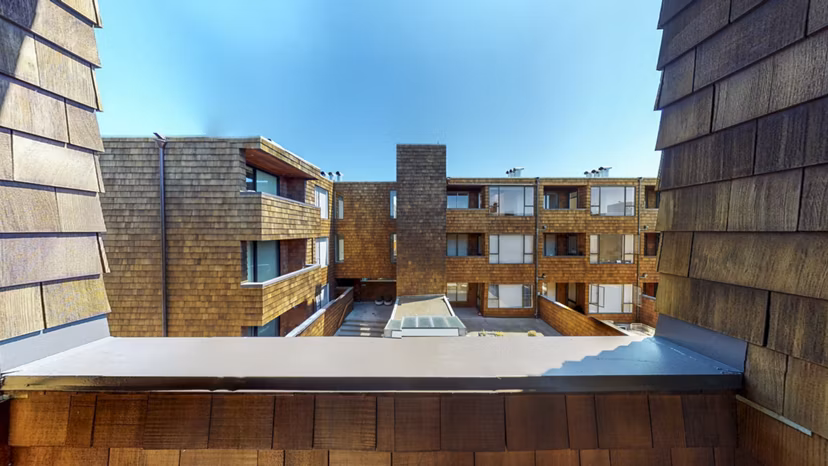 Spacious patio with modern furniture at 2133 Stockton Apartments, perfect for outdoor relaxation and city views