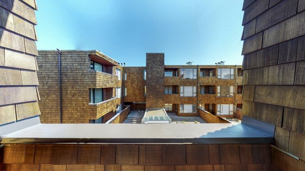 Spacious patio with modern furniture at 2133 Stockton Apartments, perfect for outdoor relaxation and city views